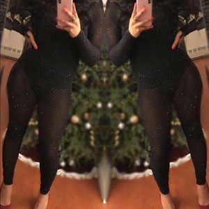Sheer studded black catsuit.